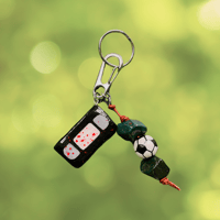 Image 1 of out there keychain