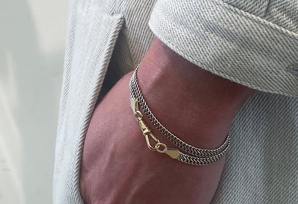 REFLECTING IN THE MORNING, SHINING BY NIGHT

Our Silver Wrap-Around Bracelet wraps elegantly two times around the wrist.
The fluid open structure chain is luminous yet lightweight and made for living in.

Whether you prefer the cool shine of silver, the warm glow of gold it can all be found in this piece. 
The 22mm musqueton clasp (and connections parts) which functions as a ornament is available as a solid sterling 925 silver or solid 18K gold part.

Wondrous in sentiment, ...