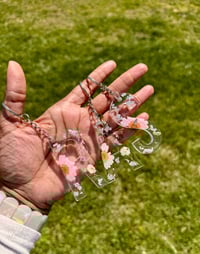 Image 2 of Floral Resin Keychain with Dried Flowers and Silver Flakes 