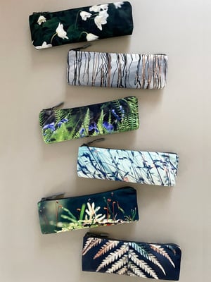 Image of Tree mosses, long travel bag, pens, brushes zipper pouch