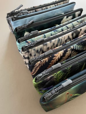 Image of Tree mosses, long travel bag, pens, brushes zipper pouch