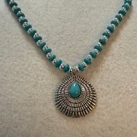 Image 1 of Howlite turquoise necklace with silver tone spacers and  silver tone pendant.