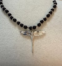 Image 1 of Onyx necklace with silver tone spacers and silver tone dragonfly pendant.