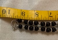 Image 2 of Onyx necklace with silver tone spacers and silver tone dragonfly pendant.