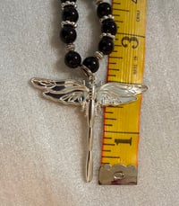 Image 4 of Onyx necklace with silver tone spacers and silver tone dragonfly pendant.