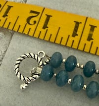 Image 2 of Chalcedony necklace with silver tone spacers and silver tone pendant.