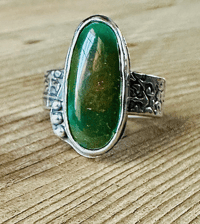 Image 1 of size 10 chunky green turquoise ring with engraved rose band