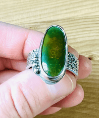Image 9 of size 10 chunky green turquoise ring with engraved rose band