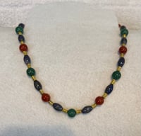 Image 1 of Aventurine, Jade, Turquoise, and Carnelian necklace with gold tone spacers.