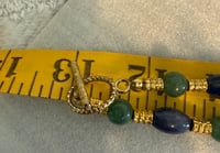 Image 2 of Aventurine, Jade, Turquoise, and Carnelian necklace with gold tone spacers.