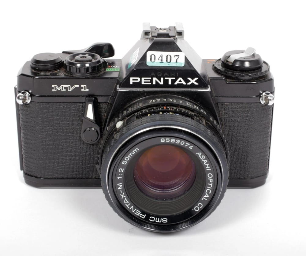 Image of Pentax MV-1 35mm SLR Film Camera with 50mm F2 SMC A lens #0407