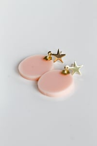 Image 1 of Peach dangly acrylic round earrings with star-shaped post