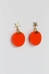 Image 1 of Orange dangly acrylic round earrings with star-shaped post