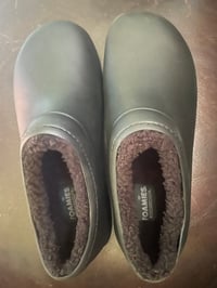 Foaming black nurse’s shoes.