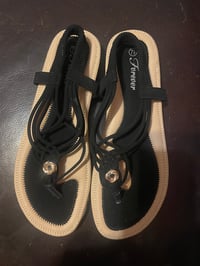 Image 3 of Forever 21 flat black sandal with strap on the back.