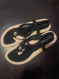 Image 4 of Forever 21 flat black sandal with strap on the back.