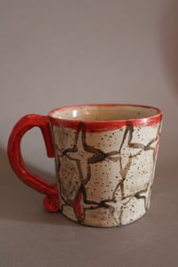 Image 1 of Taza roja y negra