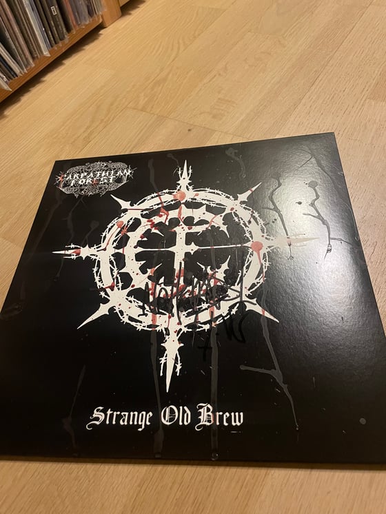 Image of Carpathian Forest Lp sign with blood.