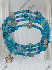 Image 2 of ANA826145 - Lt. Blue Memory Wire Bracelet w/Silver Charm