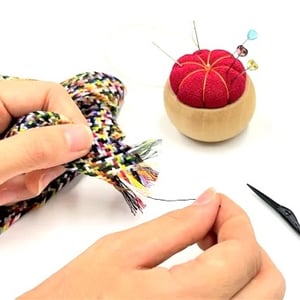 Image of Hand stitching thread