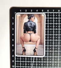Image 2 of Gorgeous Brunette In Black Leather Jacket, Thong, & High Heels Booty Squat Matte Vinyl Sticker
