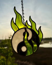 Image 2 of yin yang in green flames