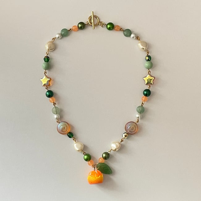 'tangerine star and swirl' gold necklace