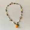 'tangerine star and swirl' gold necklace