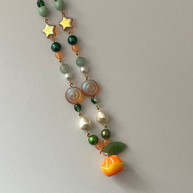 'tangerine star and swirl' gold necklace