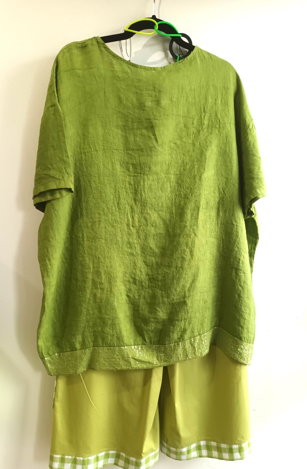 Image of green linen tunic with sparkling accents