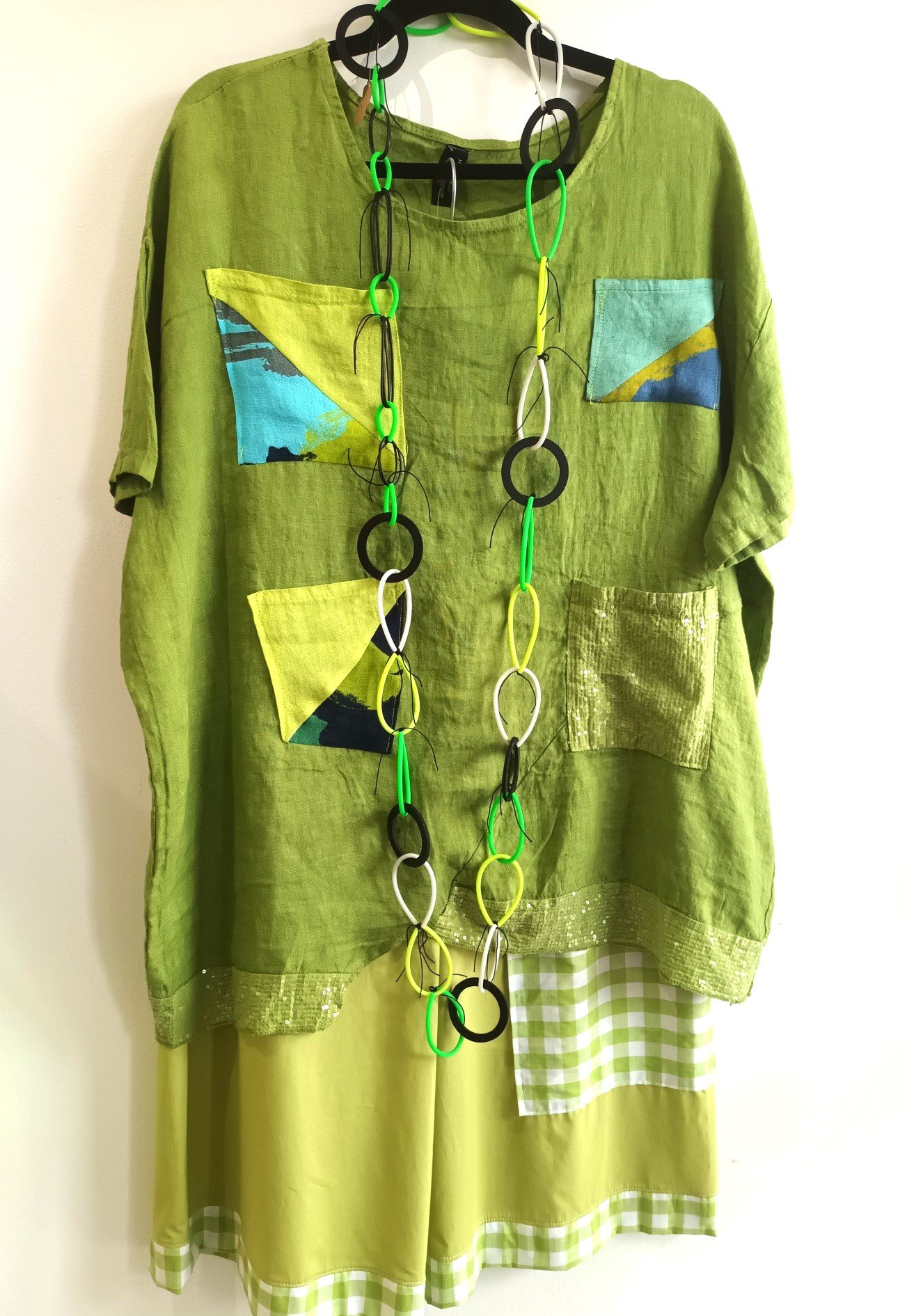Image of green linen tunic with sparkling accents