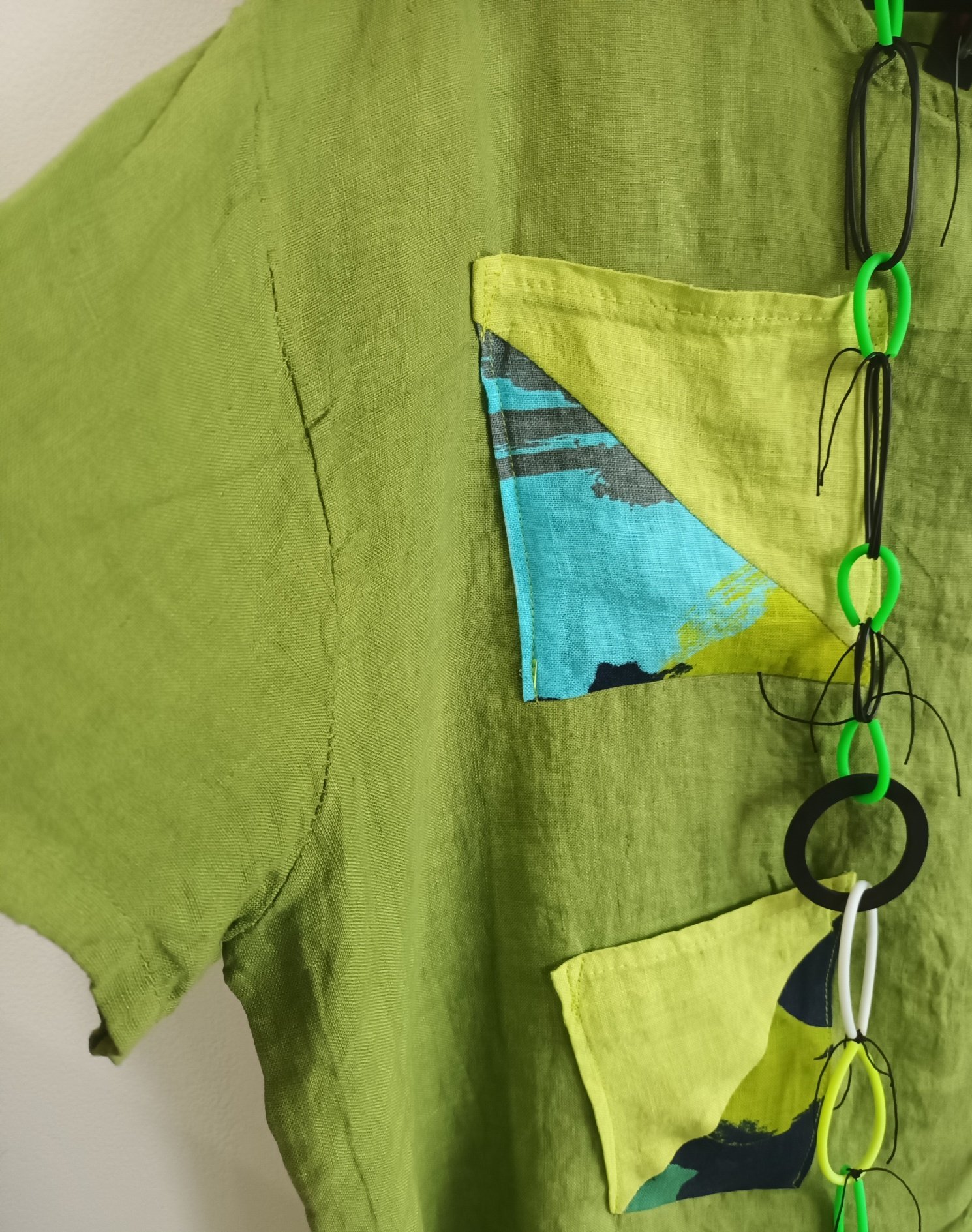 Image of green linen tunic with sparkling accents
