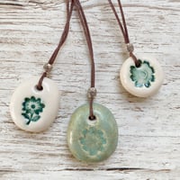 Image 1 of Handmade Ceramic Pebble Pendants – Wearable Essential Oil Diffuser