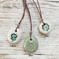 Image 2 of Handmade Ceramic Pebble Pendants – Wearable Essential Oil Diffuser