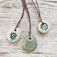 Image 3 of Handmade Ceramic Pebble Pendants – Wearable Essential Oil Diffuser