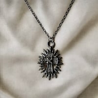 Spiked Sun & Cross