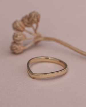 Image of 18ct yellow gold, 2mm milled edge wishbone ring