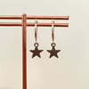 mini silver star huggie hoop earrings