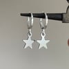 mini silver star huggie hoop earrings