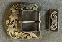 Image 1 of Steel with Sterling Floral Overlay Cowboy Belt Buckle and Keeper. Mike Pardue. Midland Texas.