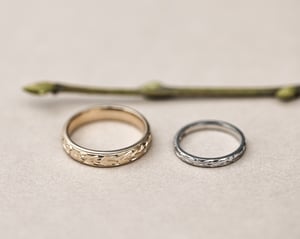 Image of 9ct yellow gold 4mm ‘Olive leaf’ and milled edge engraved ring