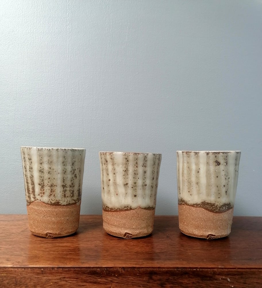 Image of Finger wiped white slip and ash glazed Beakers