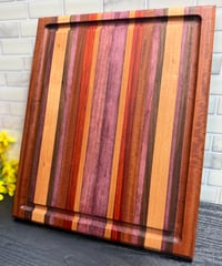 Image 1 of Purple Heart, Padauk, Walnut, Cherry, and Sapele Cutting Board
