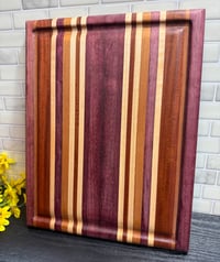 Image 1 of Purple Heart, Sapele, Walnut, Cherry, and Maple Cutting Board