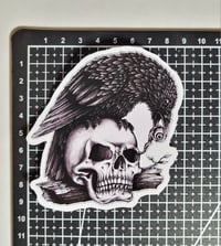 Image 2 of Raven Plucking An Eyeball Out Of A Skull Matte Vinyl Sticker