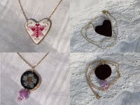 Cross stitch pendant necklaces
