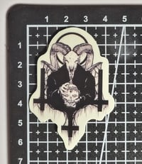 Image 2 of Glow In The Dark 3 Upside-Down Crosses With Satanic Priest Holding A Skull Glossy Finish Sticker