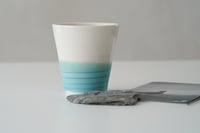 Image 4 of a cup by the sea