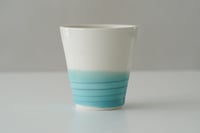 Image 1 of a cup by the sea