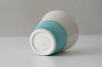 Image 2 of a cup by the sea